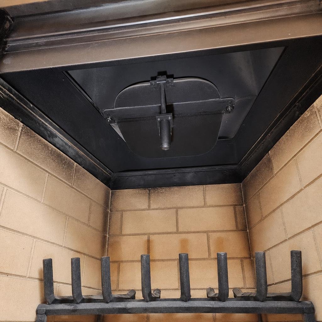 View into a clean, well-maintained fireplace smoke chamber